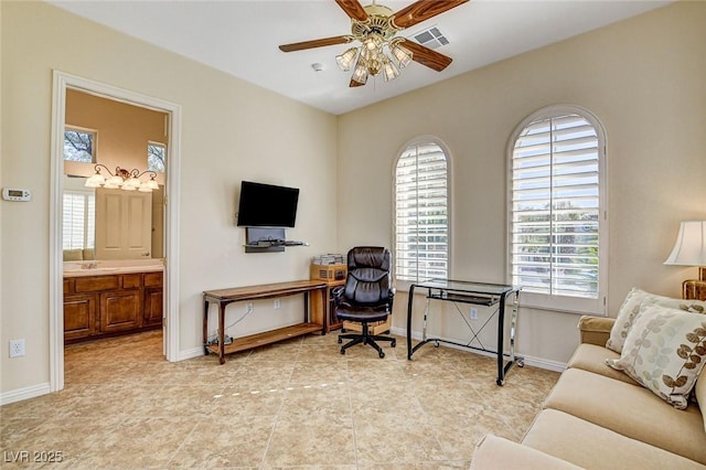 home office with light tile patterned flooring and ceiling fan