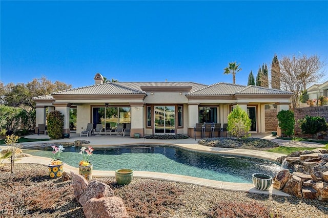 rear view of house with a patio