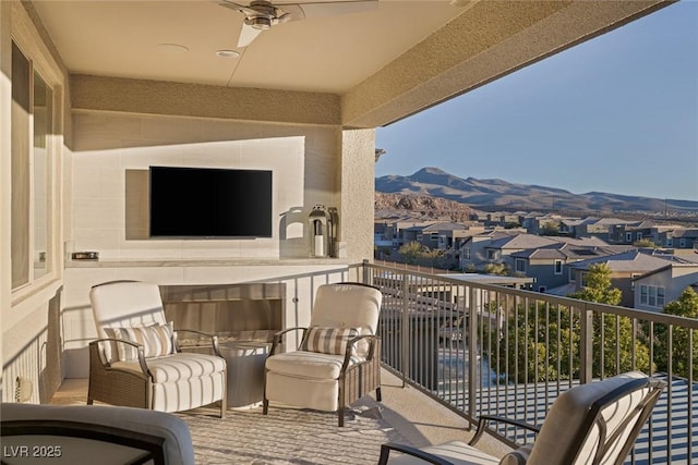 balcony with ceiling fan and a residential view