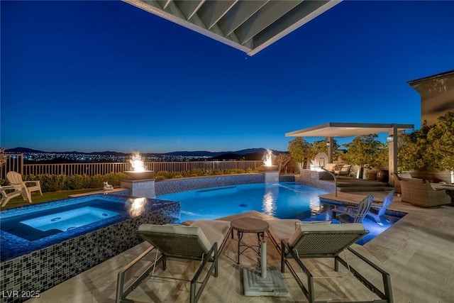 view of swimming pool with an in ground hot tub, a patio area, a fenced backyard, and a fenced in pool