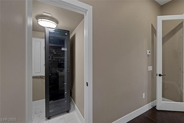 interior space with marble finish floor and baseboards