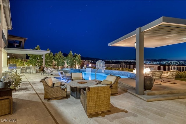 pool at twilight featuring an outdoor fire pit, a fenced in pool, area for grilling, a patio, and grilling area