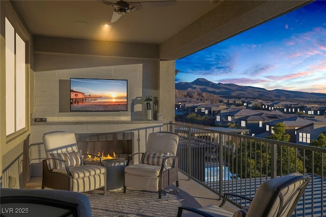 balcony featuring a ceiling fan