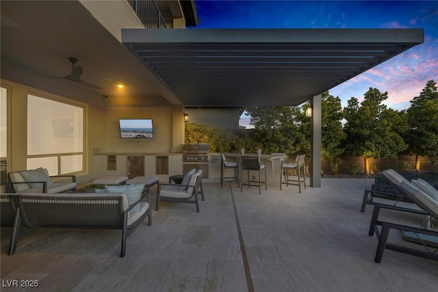 view of patio / terrace with an outdoor kitchen, a grill, fence, an outdoor living space, and a pergola