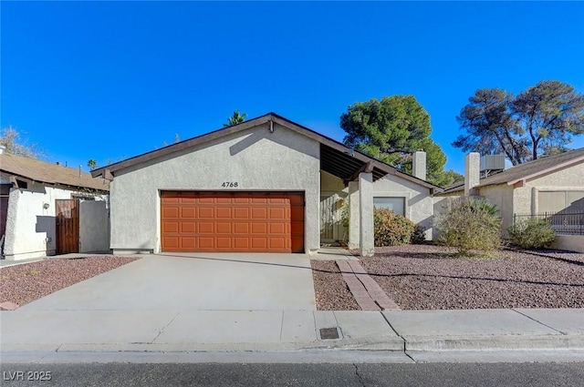 ranch-style house featuring a garage