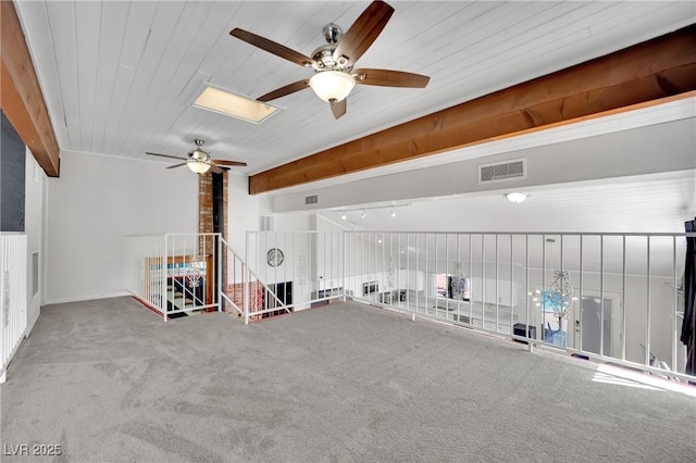 interior space with wood ceiling, carpet flooring, and visible vents