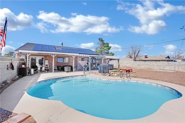 view of swimming pool with a patio area, a fenced backyard, a fenced in pool, and a gazebo