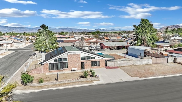 bird's eye view with a residential view and a mountain view