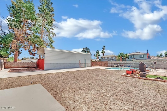 view of yard featuring a patio area, a fenced backyard, and a fenced in pool