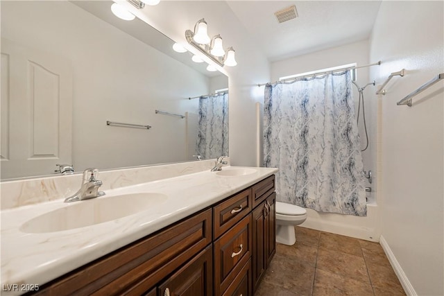 full bathroom with tile patterned floors, vanity, toilet, and shower / bath combo with shower curtain