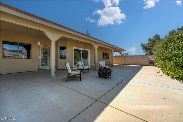 view of patio featuring a fire pit