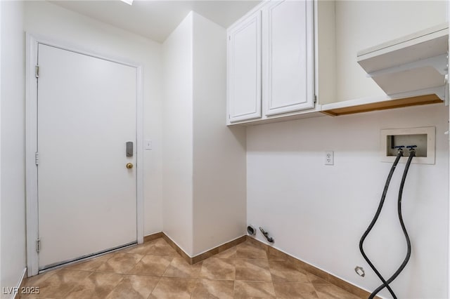 clothes washing area featuring cabinets, hookup for a gas dryer, washer hookup, and light tile patterned floors