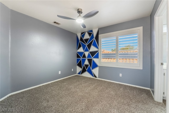 interior space with carpet floors and ceiling fan