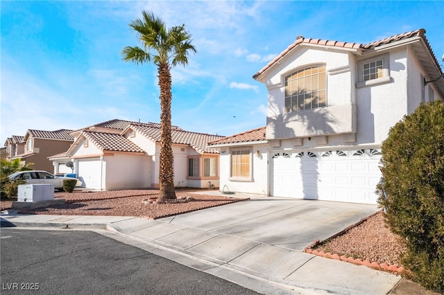 mediterranean / spanish house featuring a garage