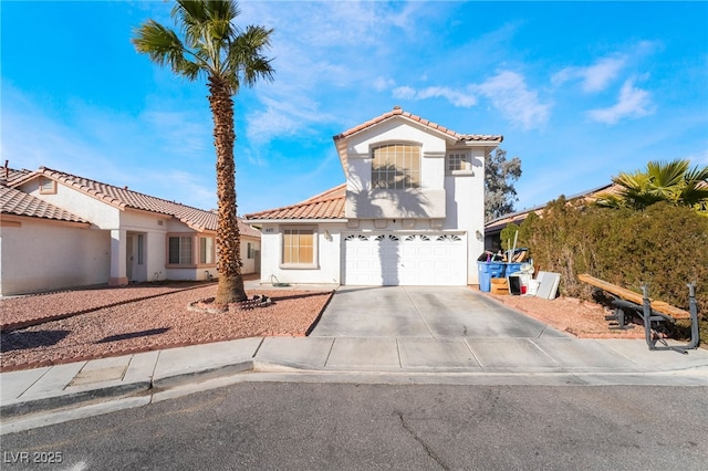 mediterranean / spanish-style house featuring a garage