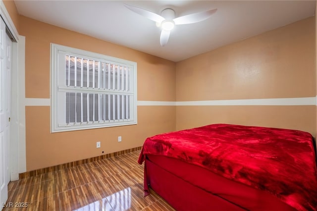 bedroom featuring ceiling fan and a closet