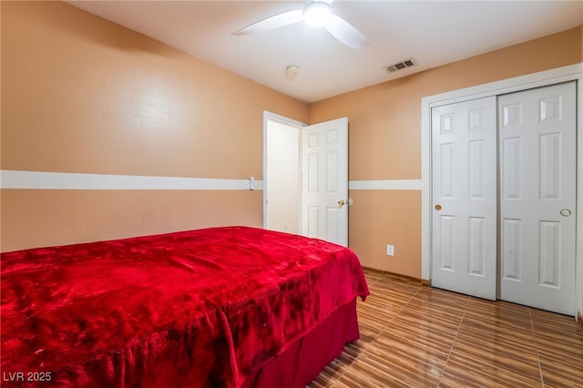 tiled bedroom with ceiling fan