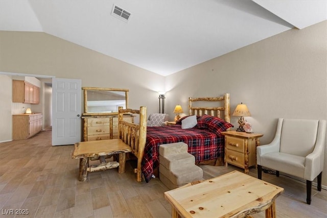 bedroom featuring vaulted ceiling