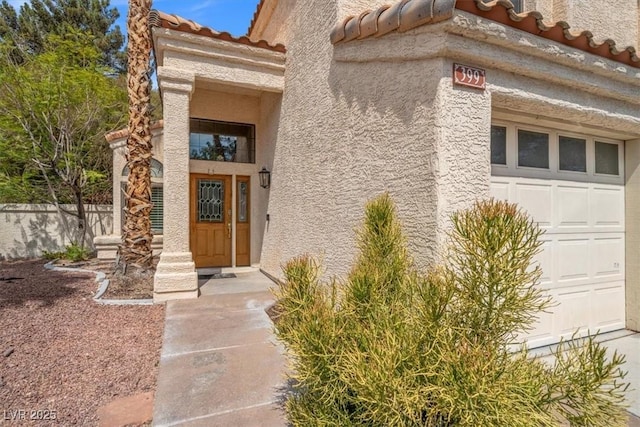 property entrance with a garage