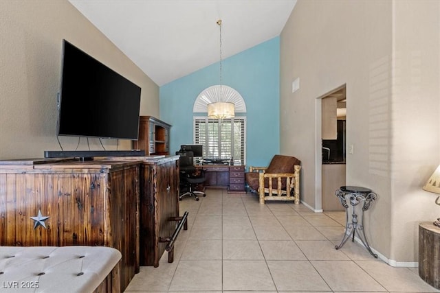 home office with a notable chandelier, high vaulted ceiling, and light tile patterned flooring