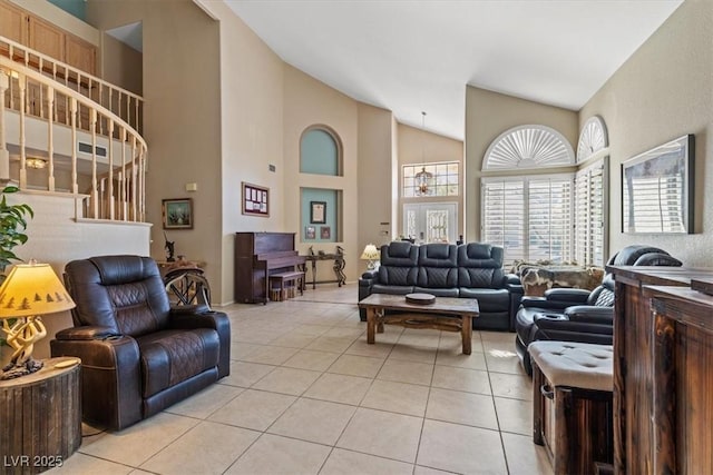 tiled living room with high vaulted ceiling