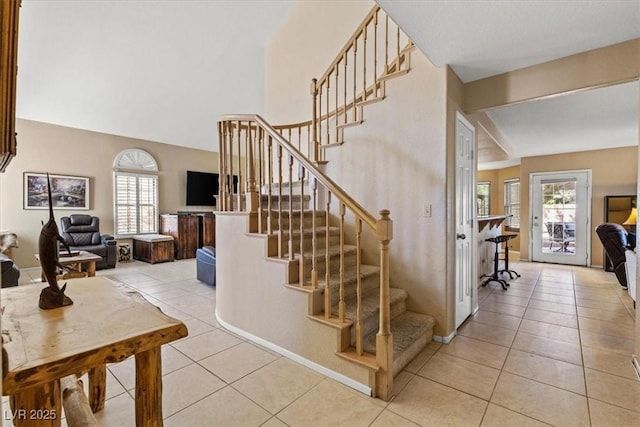 stairway with tile patterned flooring