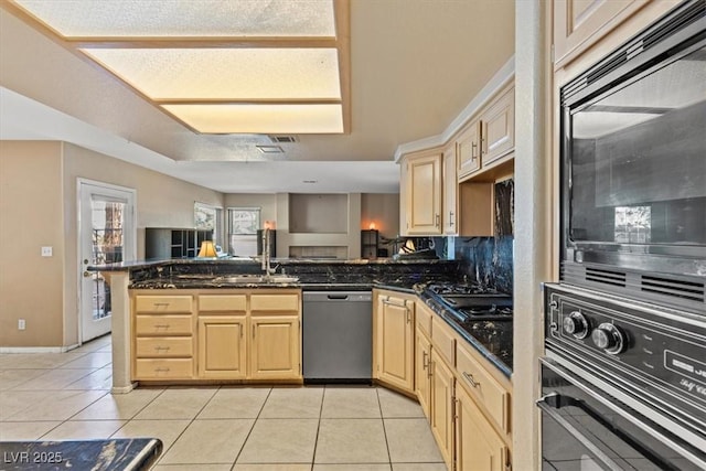 kitchen featuring light tile patterned flooring, sink, light brown cabinets, kitchen peninsula, and black appliances