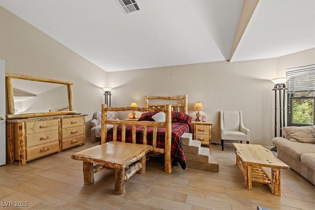 bedroom with lofted ceiling