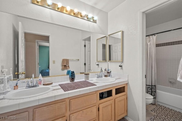 full bathroom featuring shower / tub combo with curtain, vanity, toilet, and tile patterned flooring