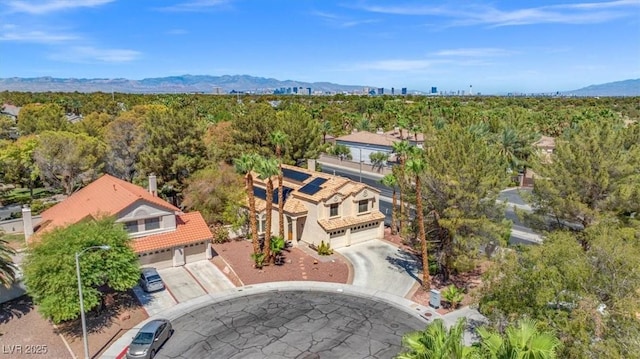 birds eye view of property featuring a mountain view