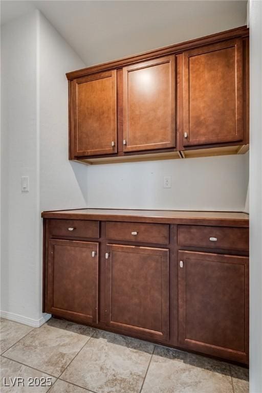 kitchen featuring light countertops and baseboards