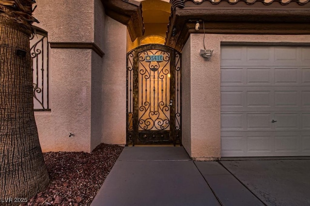 view of exterior entry featuring a garage