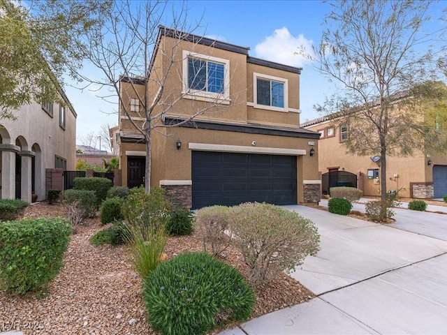 view of front of house featuring stucco siding, concrete driveway, an attached garage, fence, and stone siding