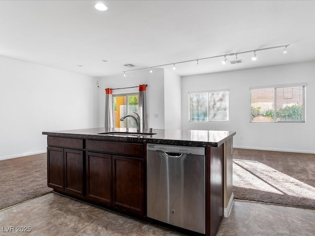 kitchen featuring a sink, carpet, open floor plan, and stainless steel dishwasher