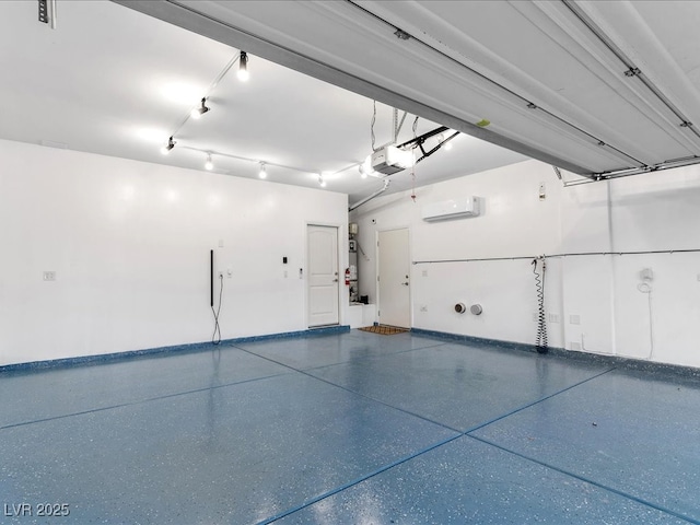 garage with a wall mounted AC, baseboards, and a garage door opener