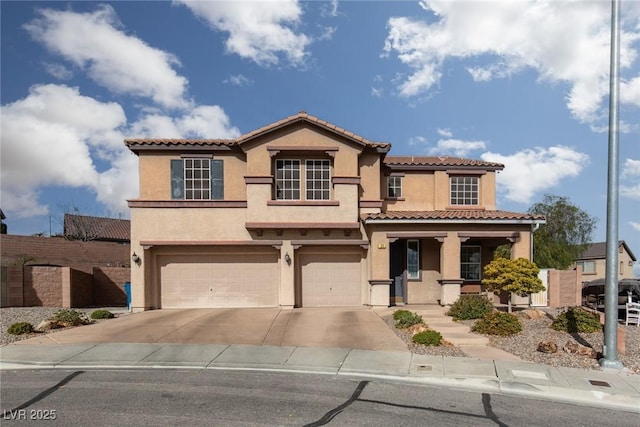 mediterranean / spanish-style house featuring a garage and a porch