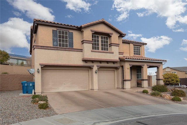 mediterranean / spanish-style home featuring a garage