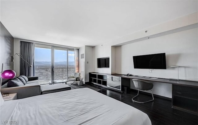4381 W Flamingo Rd Unit 3007, Las Vegas, NV 89103 - bedroom with access to outside, wood finished floors, floor to ceiling windows, and baseboards