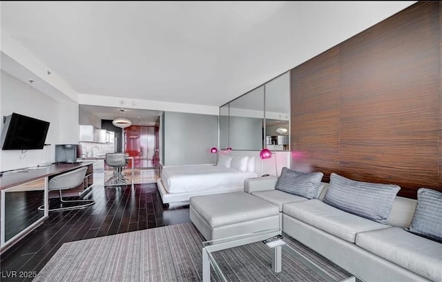 4381 W Flamingo Rd Unit 3007, Las Vegas, NV 89103 - living area featuring dark wood-style floors