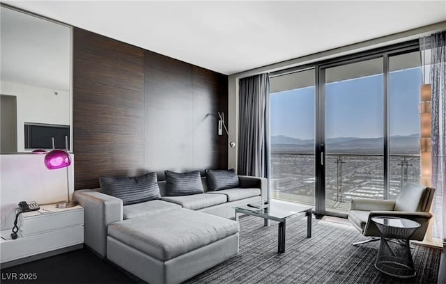 4381 W Flamingo Rd Unit 3007, Las Vegas, NV 89103 - living room featuring a mountain view and a wall of windows