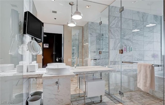 4381 W Flamingo Rd Unit 3007, Las Vegas, NV 89103 - bathroom featuring a shower stall, vanity, and visible vents