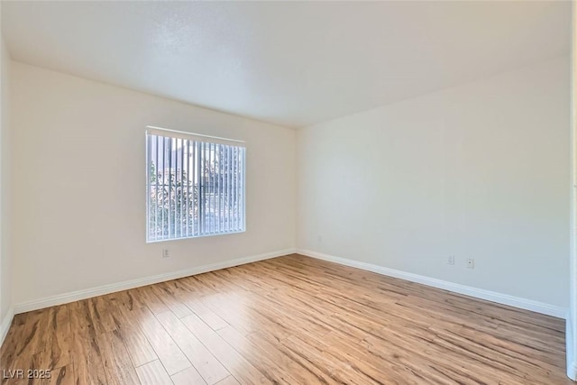 empty room with light hardwood / wood-style floors