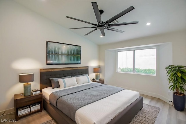 bedroom with ceiling fan, baseboards, light wood-type flooring, vaulted ceiling, and recessed lighting