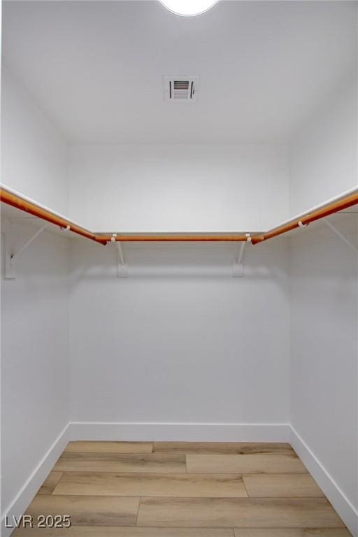 walk in closet with visible vents and light wood-style flooring