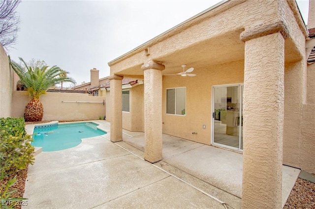 view of swimming pool featuring a patio area, a fenced in pool, a fenced backyard, and ceiling fan