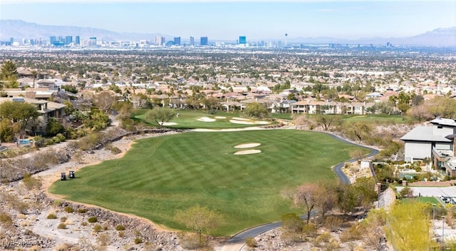 bird's eye view with a mountain view, golf course view, and a city view