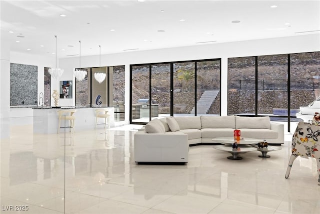 unfurnished living room featuring a sink and recessed lighting