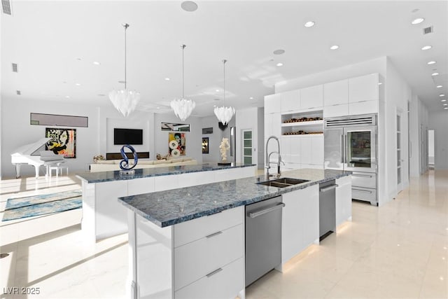 1455 Macdonald Ranch Dr, Henderson, NV 89012 - kitchen with appliances with stainless steel finishes, modern cabinets, a large island with sink, a sink, and recessed lighting
