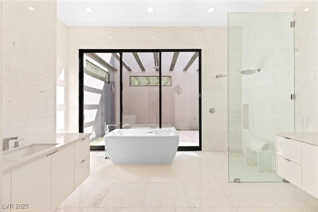 1455 Macdonald Ranch Dr, Henderson, NV 89012 - full bath with a shower stall, vanity, a soaking tub, recessed lighting, and tile walls