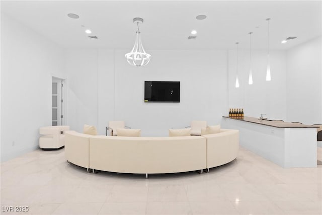 living room featuring visible vents, a chandelier, baseboards, and recessed lighting